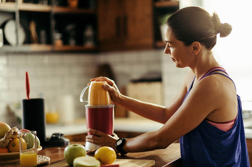 girl making a smoothie