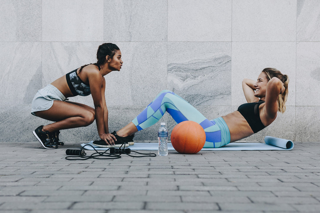 two girls working out together