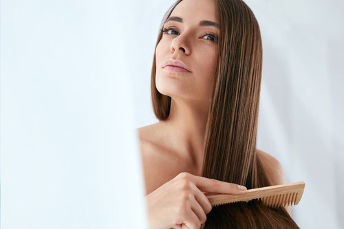 girl combing her hair