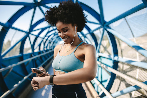 girl looking at her fitness tracker