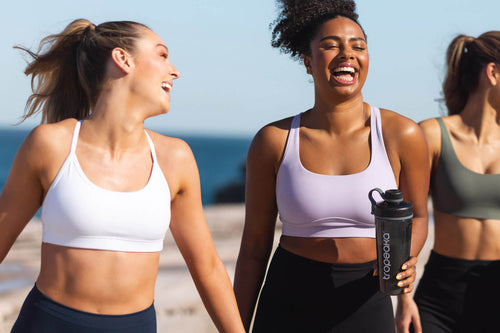 girls running on a beach